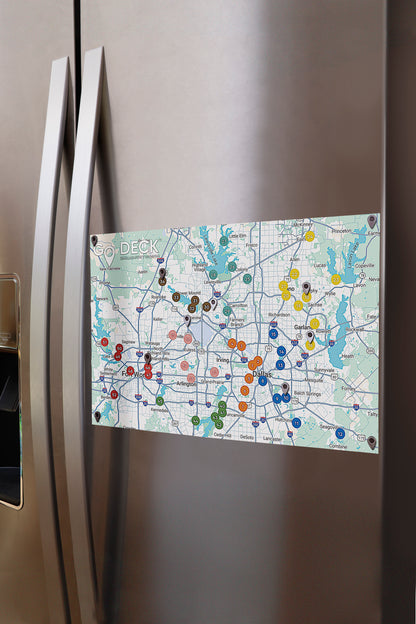 Map magnet on a refrigerator door with various colored pins.